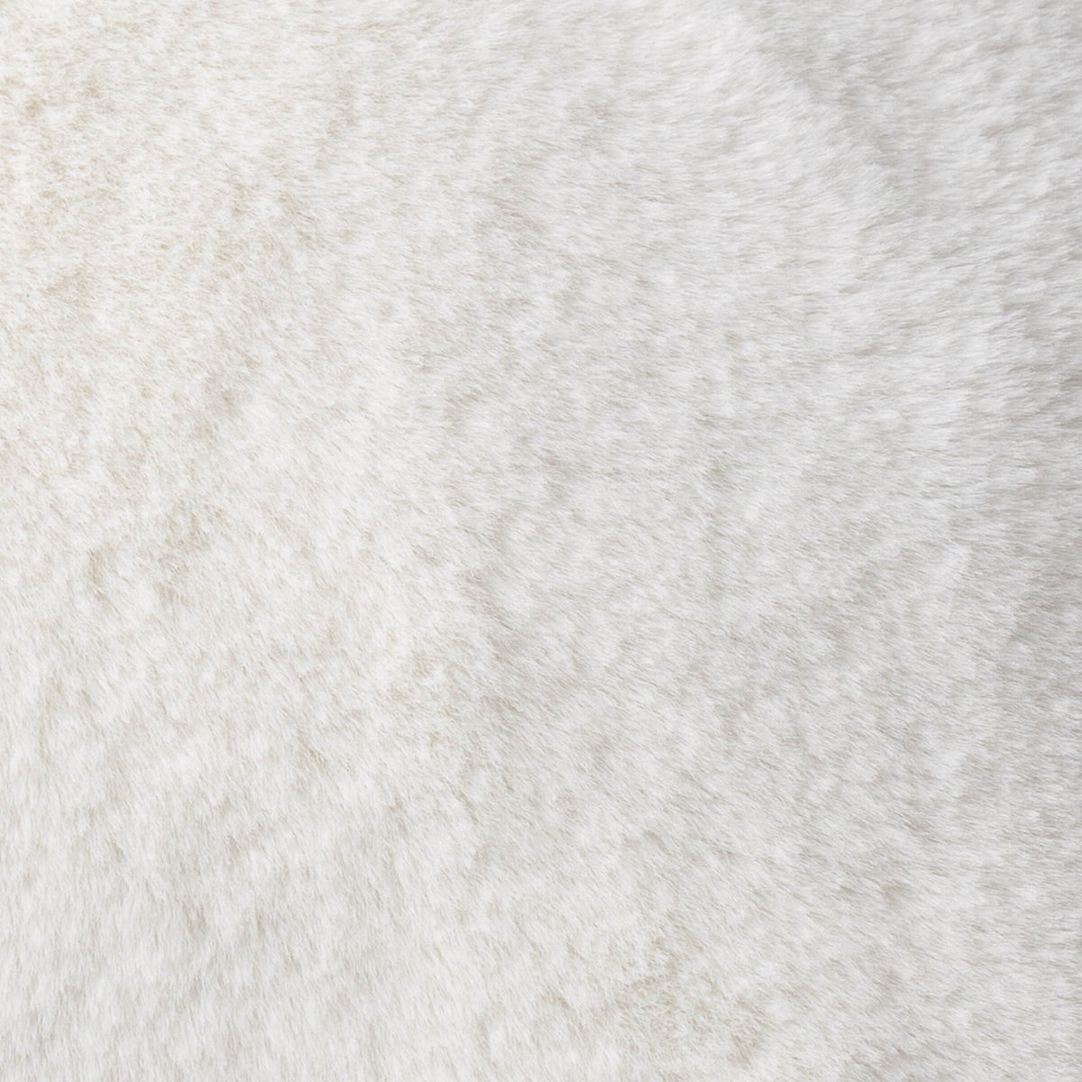 Close-up of the Kallu Reversible Faux Fur Cushion in ecru, showing the dense, plush polyester pile with subtle mottled texture.