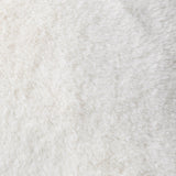 Close-up of the Kallu Reversible Faux Fur Cushion in ecru, showing the dense, plush polyester pile with subtle mottled texture.