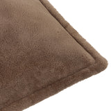Close-up of the Kallu Plain Faux Fur Cushion in mocha, showing the soft brown pile fabric and stitched edge seam on a white background.