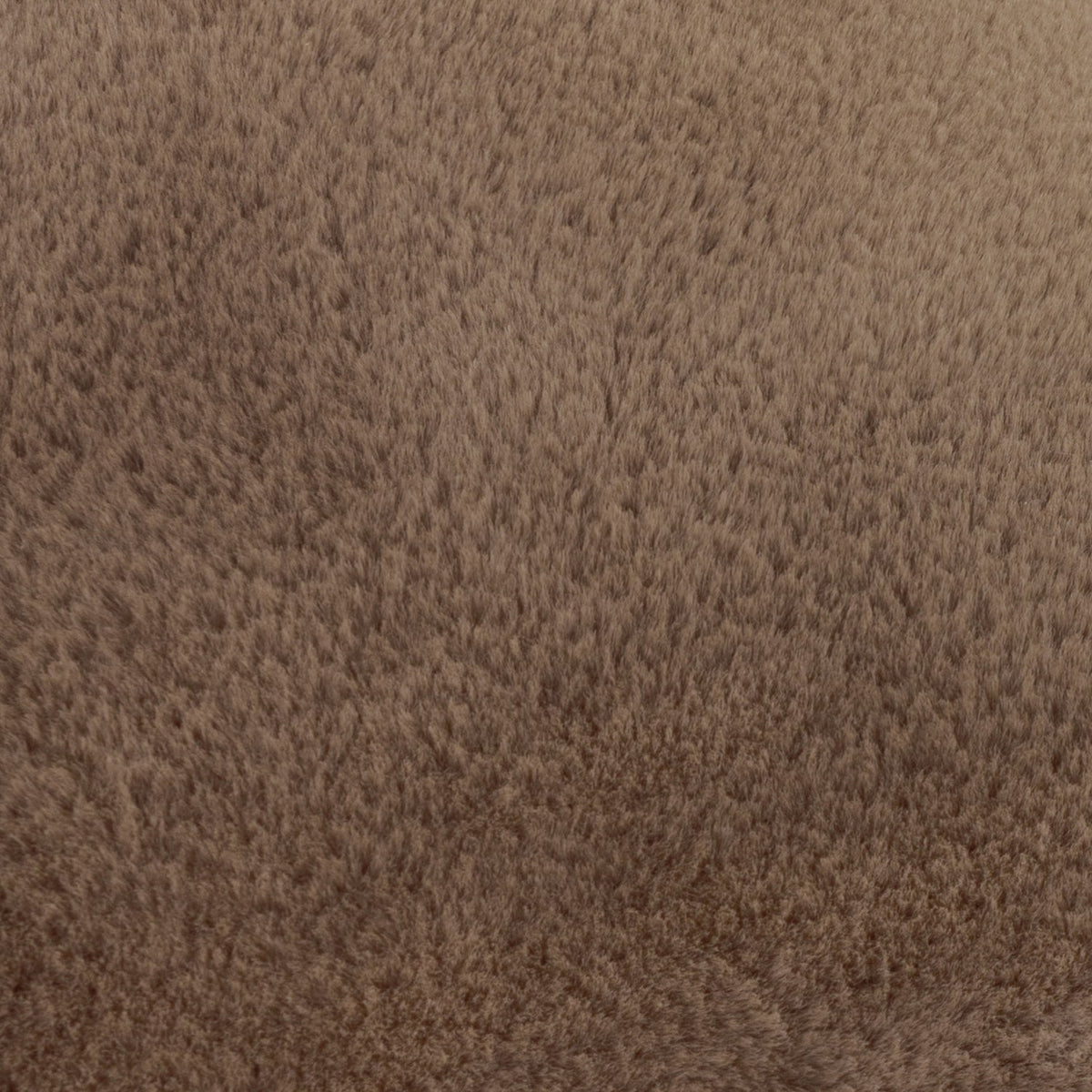 Close-up of the Kallu Plain Faux Fur Cushion in mocha, showing the soft brown pile texture covering the fabric surface.