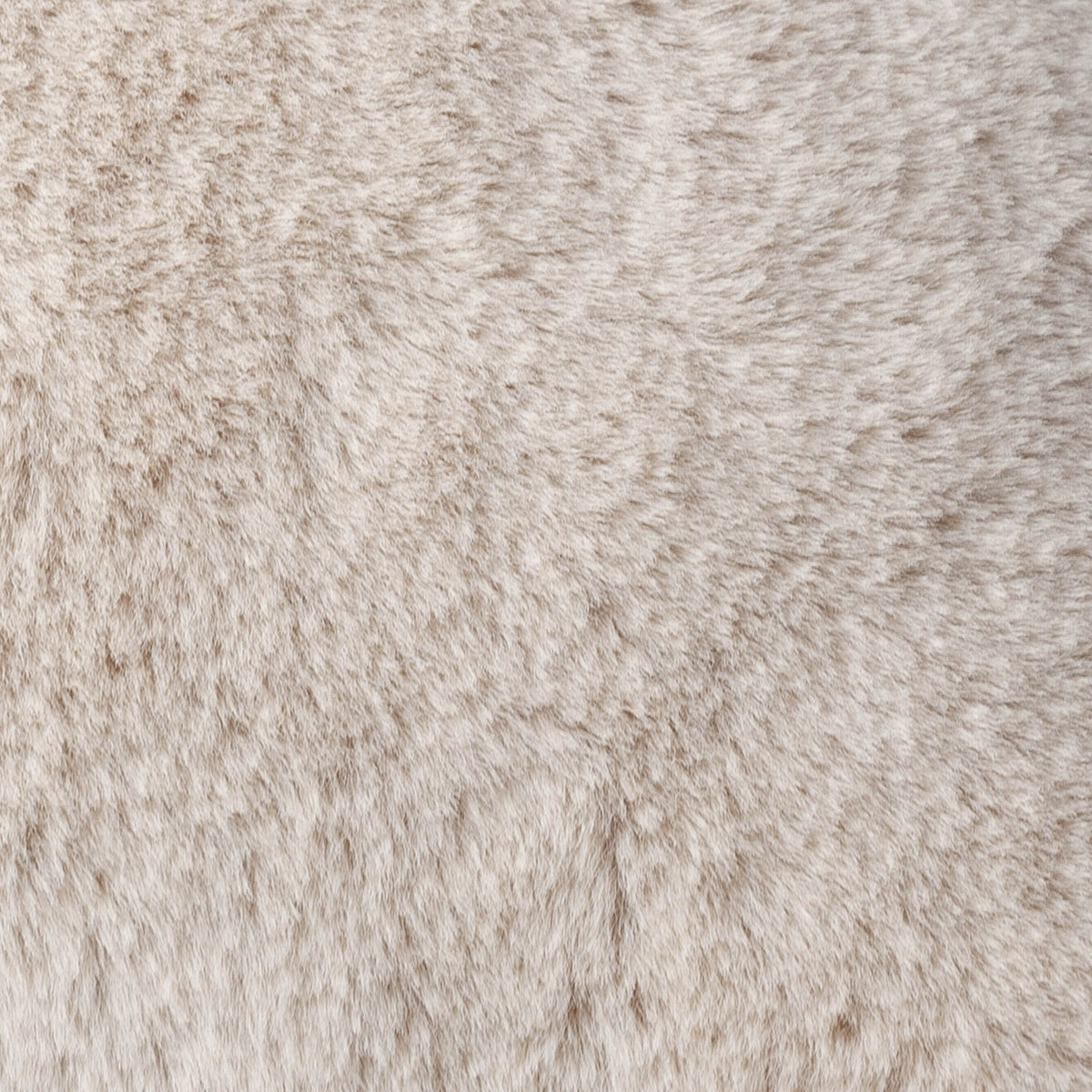 Close-up of the Kallu Reversible Faux Fur Cushion in natural beige, showing the plush pile texture with subtly shaded tones throughout.