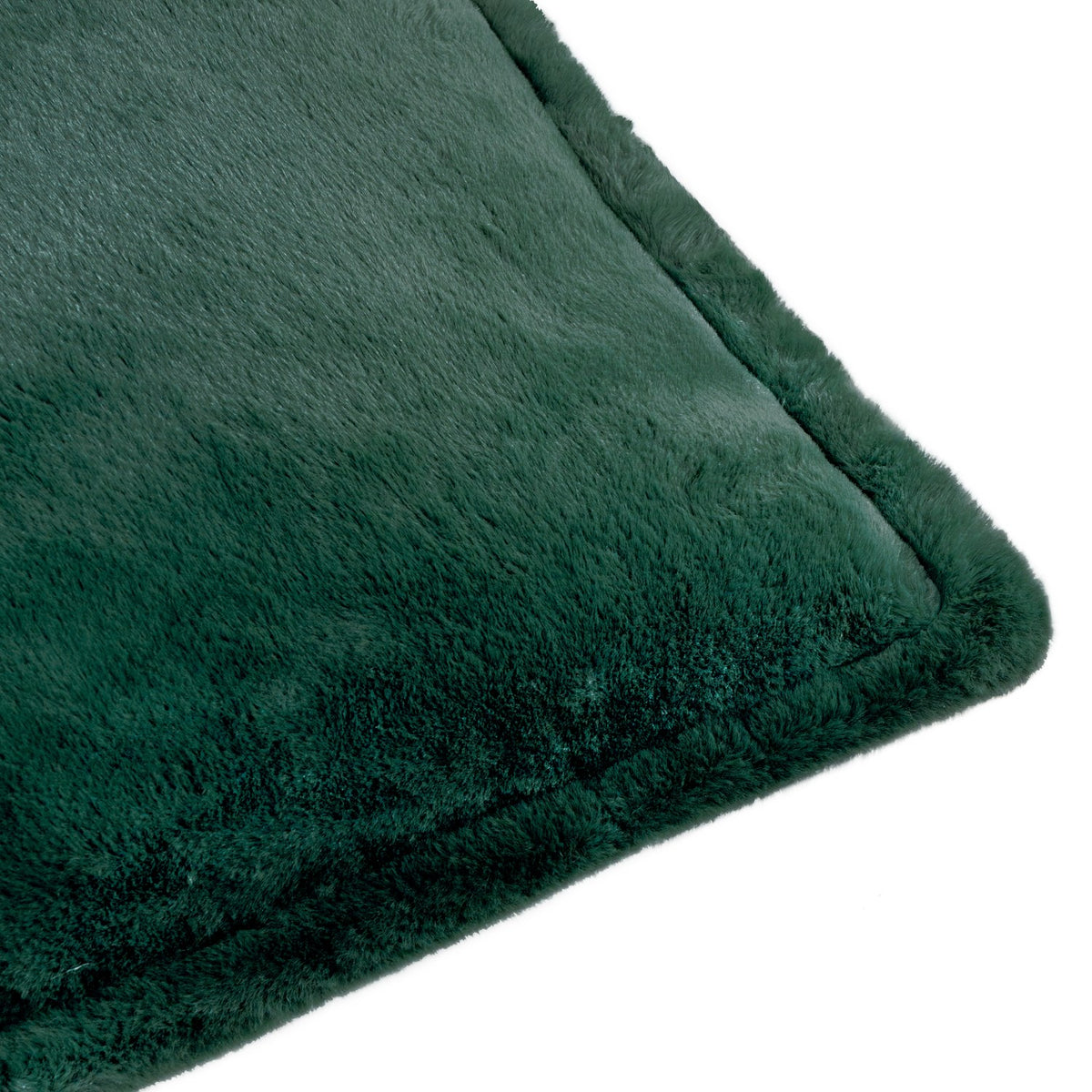 Close-up of the Kallu Plain Faux Fur Cushion in needle green, showing the plush pile texture and raised border edge, on a plain white background.