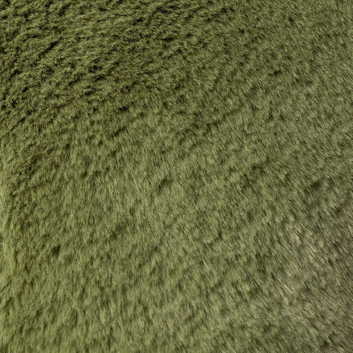 Close-up of the Kallu Reversible Faux Fur Cushion in olive green, showing its dense, plush pile texture with subtle light and shade variation.