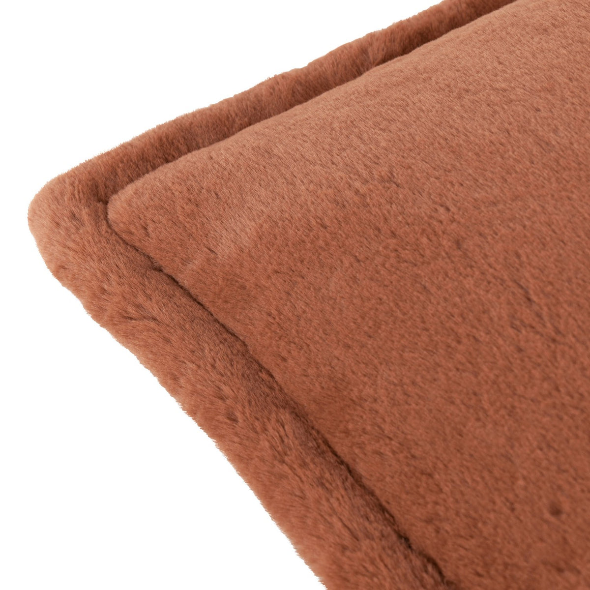 Close-up of the Kallu Reversible Faux Fur Cushion in rust, showing the dense plush pile and stitched edge seam on a plain white background.