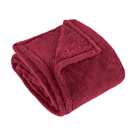 Kallu Polyester Throw in berry-red faux fur, folded to show its dense plush pile and neat edge stitching, on a plain white background.