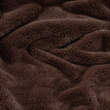 Kallu Plain Faux Fur Throw in chocolate brown, shown draped with soft, dense pile and rippling folds highlighting the plush double-sided texture.