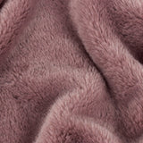 Close-up of the Kallu Reversible Faux Fur Throw in mulberry, showing dense, plush pile fabric with soft folds in a muted pink-brown tone.