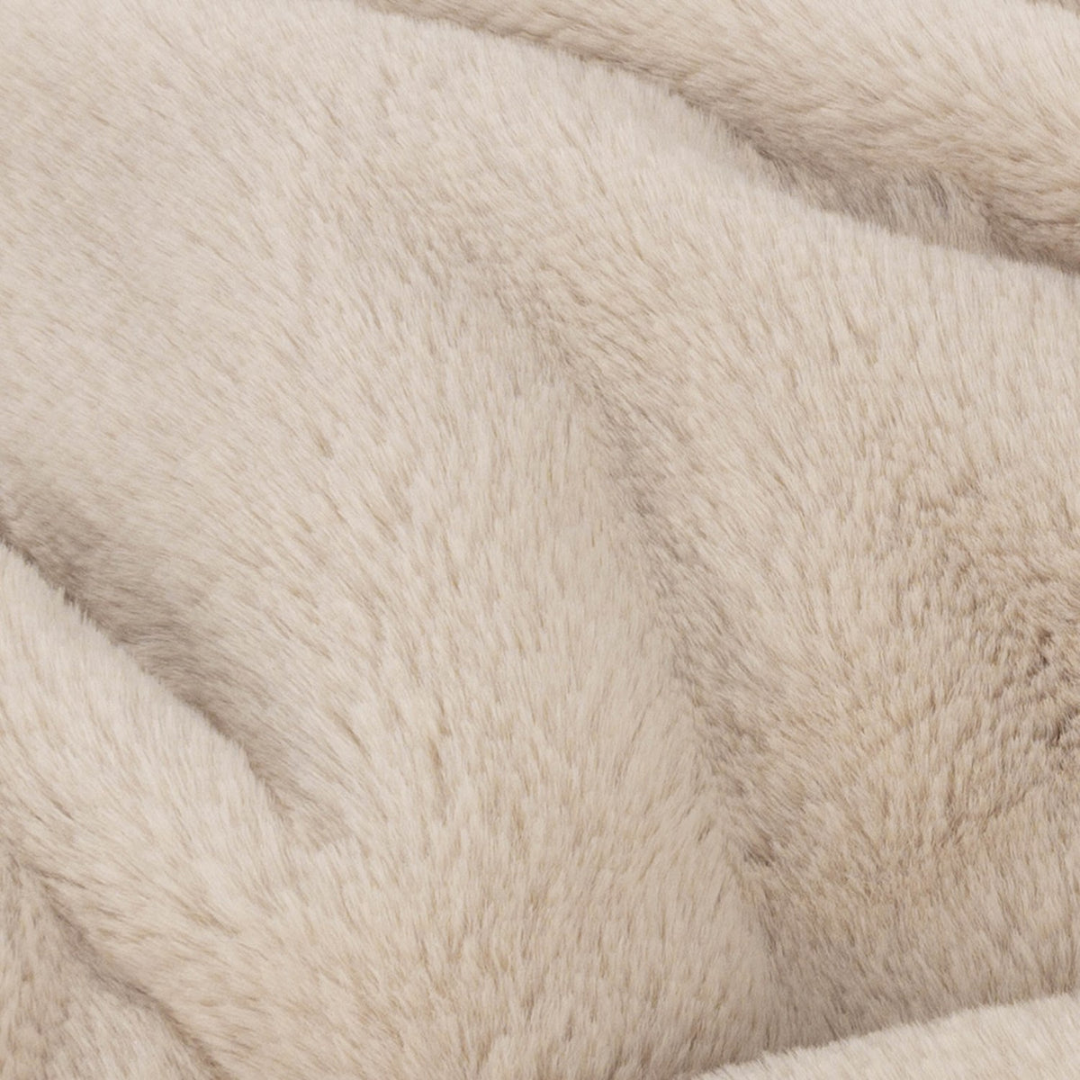 Close-up of the Kallu Reversible Faux Fur Throw in natural, showing soft, dense faux fur texture in a light beige tone.