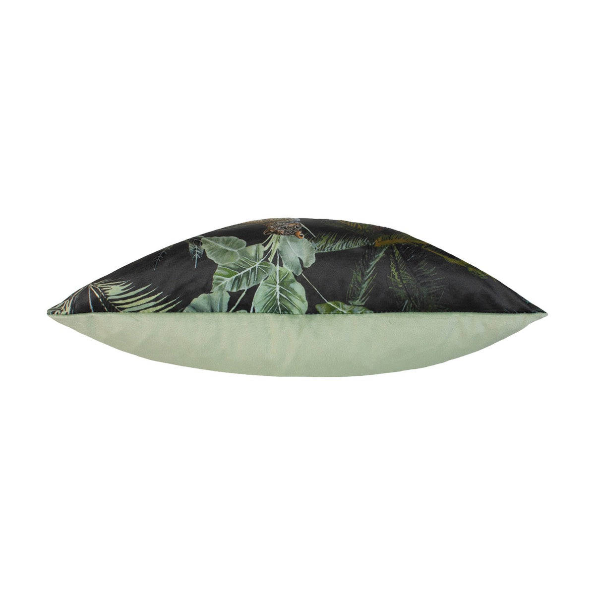 Side view of the Kibale Jungle polyester cushion showing its plump insert, dark tropical-print front with green foliage and a plain sage-green reverse, on a white background.