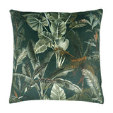 Kibale Jungle square polyester cushion with a dense tropical leaf print in green, sage and rust-brown tones on a deep forest-green ground, shown on a white background.