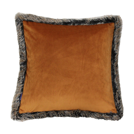 Kiruna Velvet Faux Fur Cushion in rust, square velvet-feel front bordered by a wide mottled grey-brown faux fur trim, shown on a plain white background.
