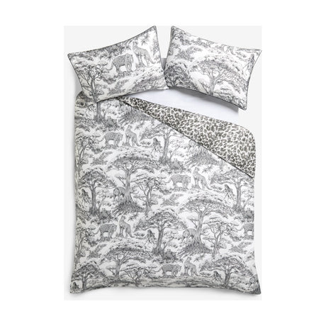 Monochrome cotton duvet cover set with black and white jungle toile pattern of trees, elephants, leopards and monkeys, plus matching pillowcases and reverse leopard print.
