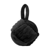 Knot Plain Velvet Door Stop in black, a rounded knot-shaped weight with a raised loop handle, finished in dense black velvet, shown on a plain white background.