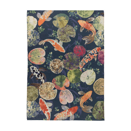 Koi Pond Animal Polyester Rug in Midnight, a rectangular flatweave rug printed with orange, white and spotted koi carp among lily pads on a deep navy blue ground, shown on a plain white background.