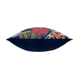 Side view of the Koi Pond Abstract Velvet Cushion in Midnight, showing its plump velvet edge with a bold multicoloured floral print on top and a plain navy reverse, on a white background.