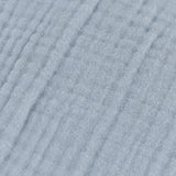 Close-up of the Lark Plain Cotton Cushion in mineral blue, showing crinkled muslin cotton fabric with a fine ribbed, textured weave.