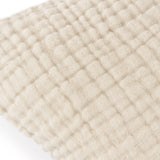 Close-up of the Lark Reversible Cotton Cushion in natural beige, showing four-layer muslin crinkle cotton with a ribbed, textured surface.