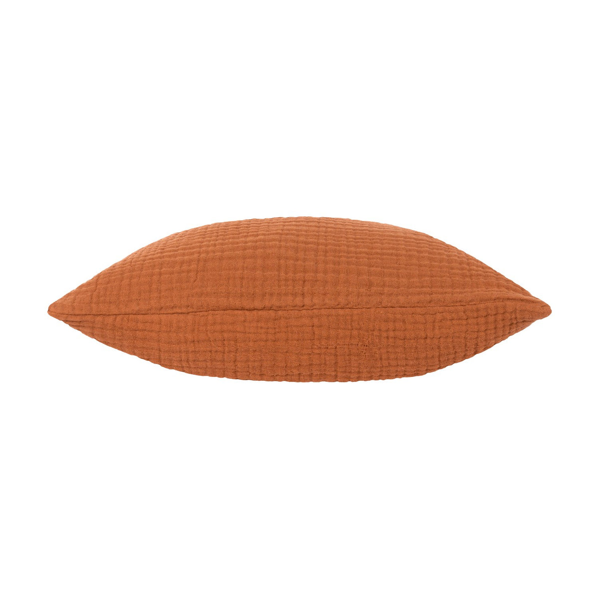 Lark Reversible Cotton Cushion in pecan rust, shown side-on to reveal its plump, textured muslin crinkle cotton fabric, on a plain white background.