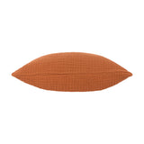 Lark Reversible Cotton Cushion in pecan rust, shown side-on to reveal its plump, textured muslin crinkle cotton fabric, on a plain white background.
