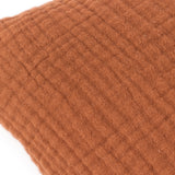 Close-up of the Lark Reversible Cotton Cushion in pecan brown, showing the ribbed texture of four-layer muslin crinkle cotton fabric on a plain white background.
