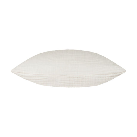 Lark Reversible Cotton Cushion in white, shown side-on to reveal its plump, textured muslin crinkle cotton surface, set against a plain white background.