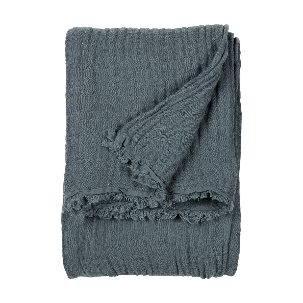 Lark Plain Cotton Throw in dusk blue, folded to show its crinkled cotton muslin texture and frayed edge, on a plain white background.