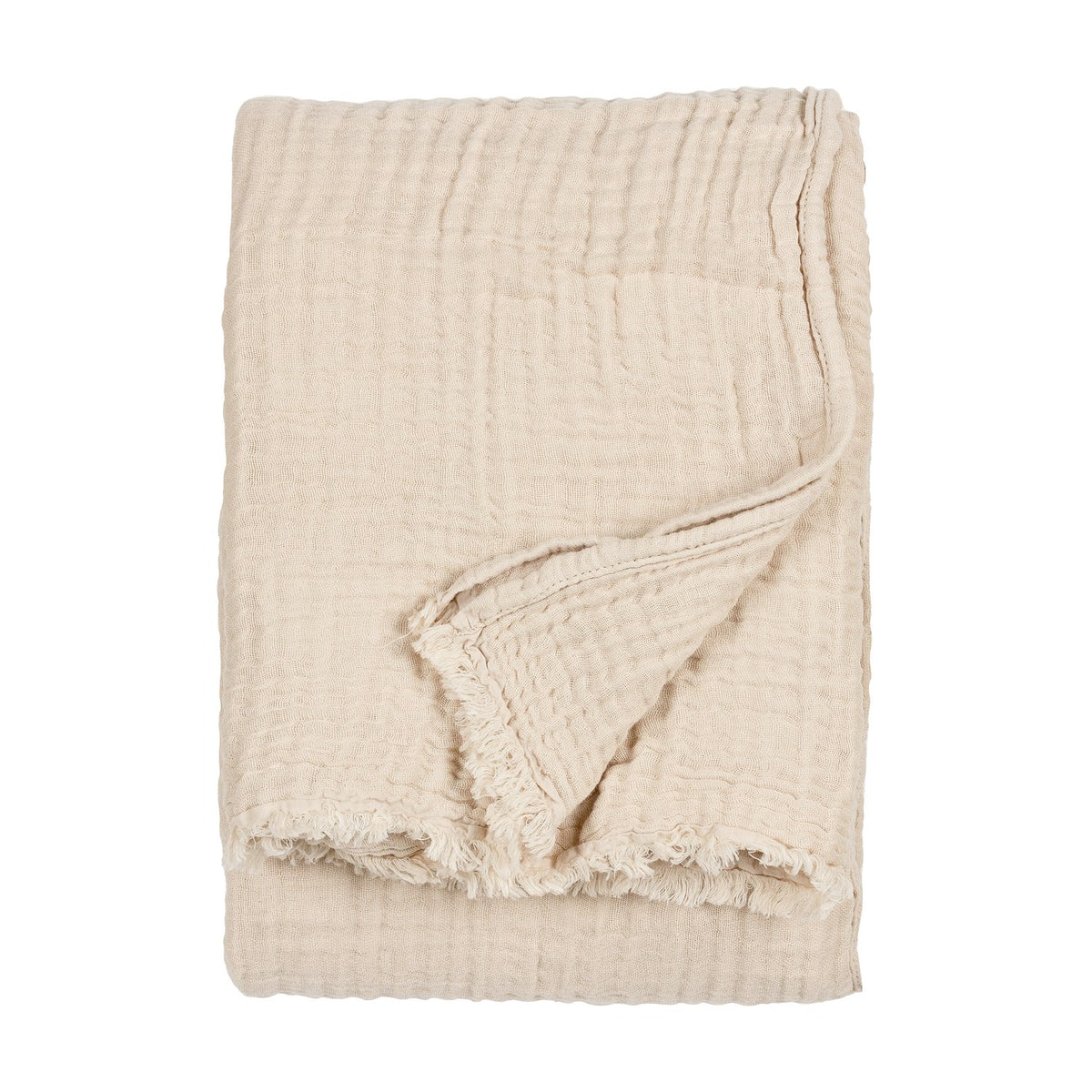 Lark Plain Cotton Throw in natural beige, folded to show its crinkled muslin texture and frayed edge detail against a plain white background.