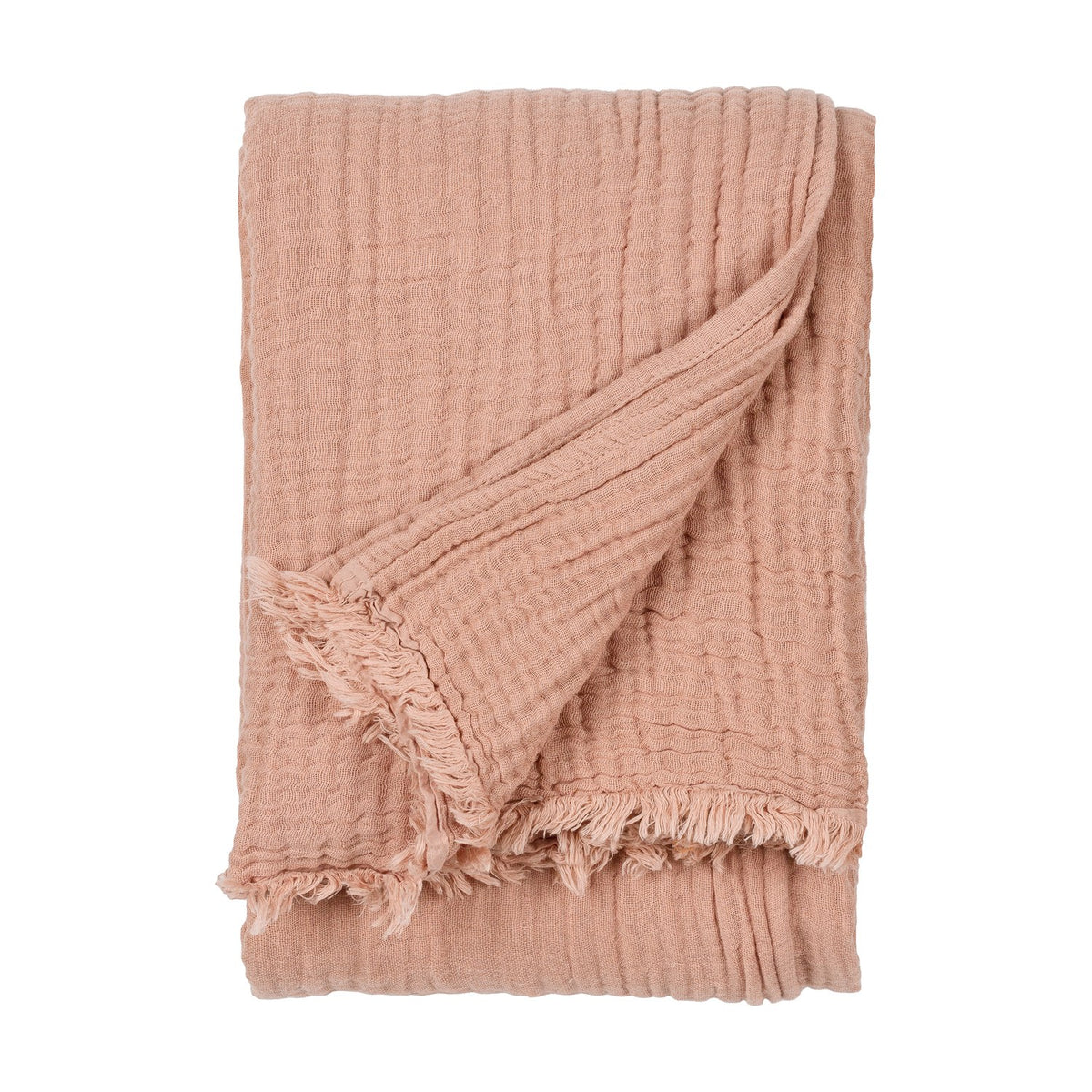 Lark Plain Cotton Throw in pink clay, folded to show crinkled muslin texture and fringed edge, on a plain white background.