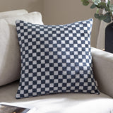 Larro Jacquard Chenille Cushion in slate blue with a woven checkerboard pattern, shown on a beige sofa in a living room setting.