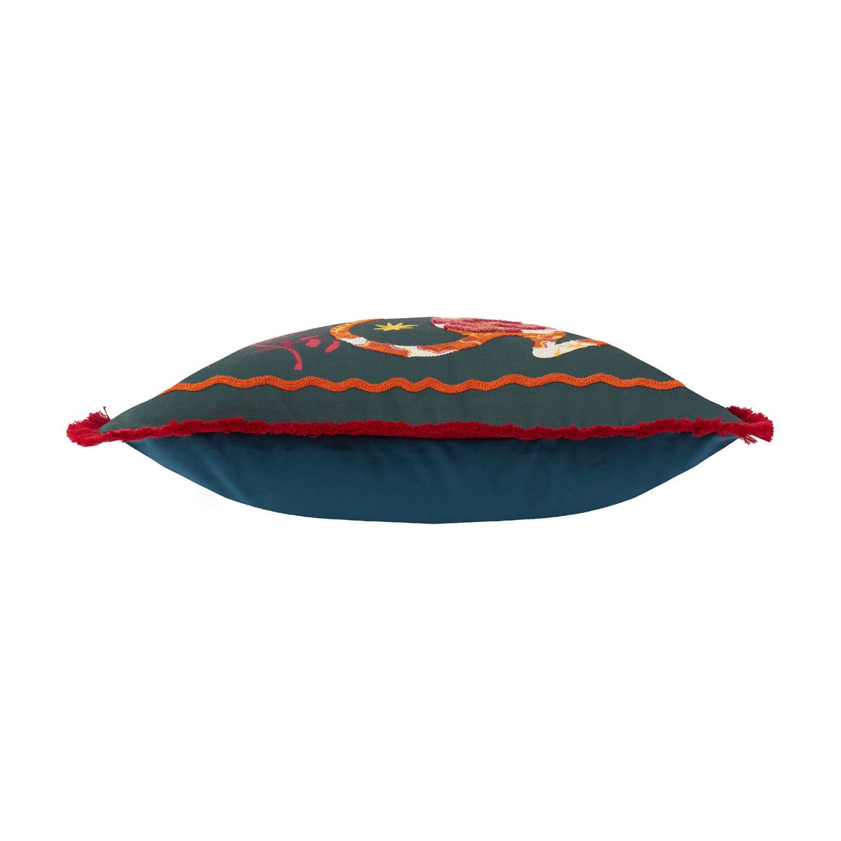 Les Animaux Tigeress cushion shown side-on, emerald canvas with embroidered tiger motif, orange wavy border trim, and red tassel corners, on a plain white background.
