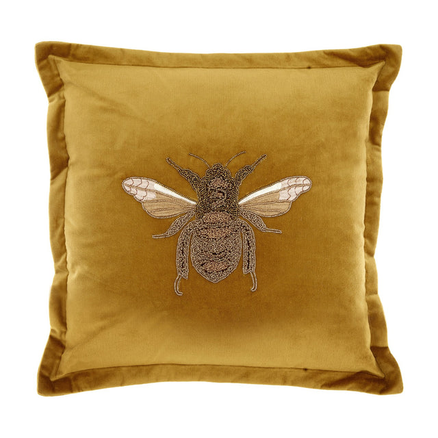 Layla Animal Velvet Cushion in mustard, a square velvet cushion with flanged edges and a beaded gold bee embroidery at the centre, shown on a plain white background.