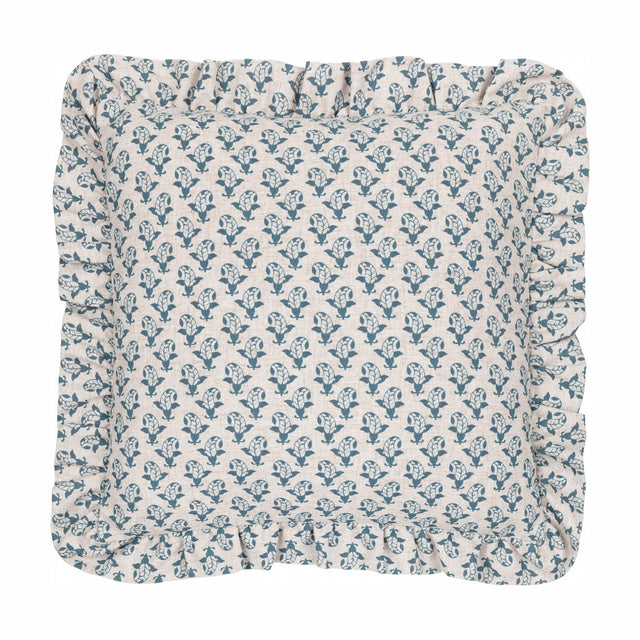 Lulah Block Floral Linen Cushion, a 45 x 45cm square cushion with a blue leaf-and-bud print on natural oatmeal linen fabric, finished with a gathered ruffle edge, on a plain white background.