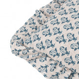 Close-up of the Lulah Block Floral Linen Cushion in blue and natural, showing a repeating leaf motif print and a gathered ruffle edge.
