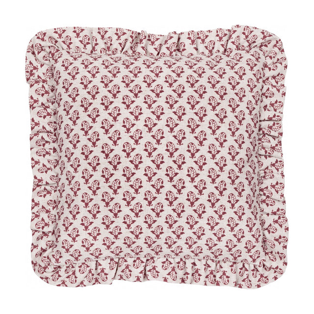 Lulah square cushion in natural linen with a red block-print floral motif and a gathered ruffle trim edge, shown on a plain white background.