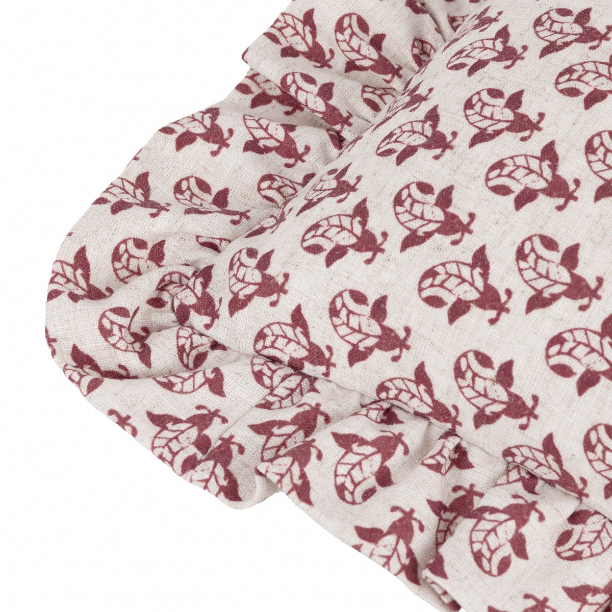 Lulah Block Floral Linen Cushion in red on natural linen, close-up of gathered ruffle trim edge with repeating block-print floral motif.