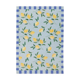 Lemons Striped Polyester Rug in Blue, featuring yellow lemon branches on a pale blue ground with a blue and cream block-striped border, shown on a plain white background.