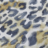 Close-up of the Leopardis cushion's woven polyester fabric, showing charcoal leopard rosettes on a cream ground with amber and tan washes.