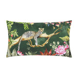 Rectangular polyester cushion in forest green, printed with a leopard resting on a branch amid tropical foliage, peonies and hummingbirds, shown on a white background.