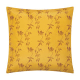 Square gold polyester cushion with a repeating leaf and vine pattern in brown tones, shown on a plain white background.
