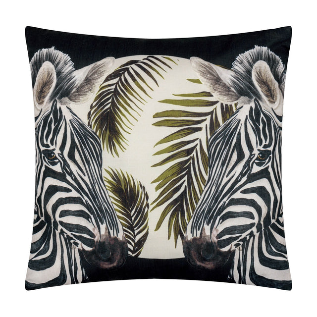 Square polyester cushion in black featuring two mirrored zebra heads with olive and cream palm fronds, part of the Leopardis reversible design.