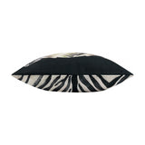Side view of the Leopardis reversible polyester cushion showing zebra head print on one edge and zebra stripe pattern on the reverse, in black and cream, on a white background.