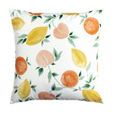 Les Fruits Abstract Polyester Cushion in multi, a 43 x 43cm square design featuring watercolour lemons, oranges and blush stone fruits among green leaves on a white ground.