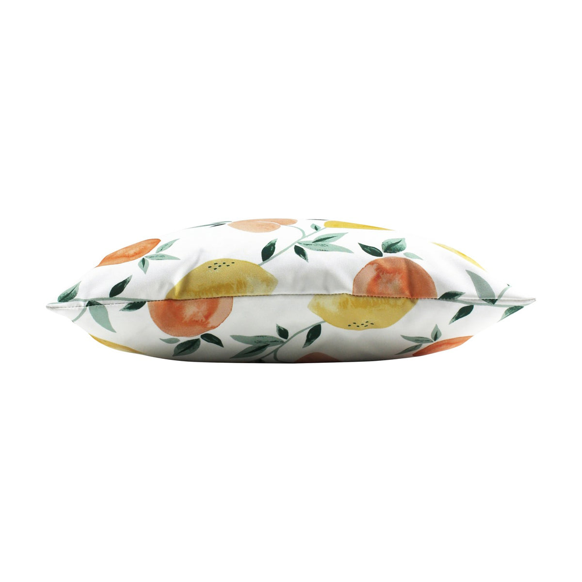 Side view of the Les Fruits Abstract Polyester Cushion, showing its plump square shape printed with watercolour lemons, oranges and green leaves on white, set against a plain background.