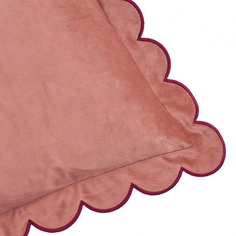 Lil Scallop Plain Velvet Cushion in dusky pink with a scalloped edge and contrast burgundy trim stitching, shown in close-up against a white background.