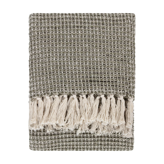 Lorne Plain Cotton Throw in Lichen, folded to show a chunky two-tone green waffle weave with cream fringed tassels, on a plain white background.