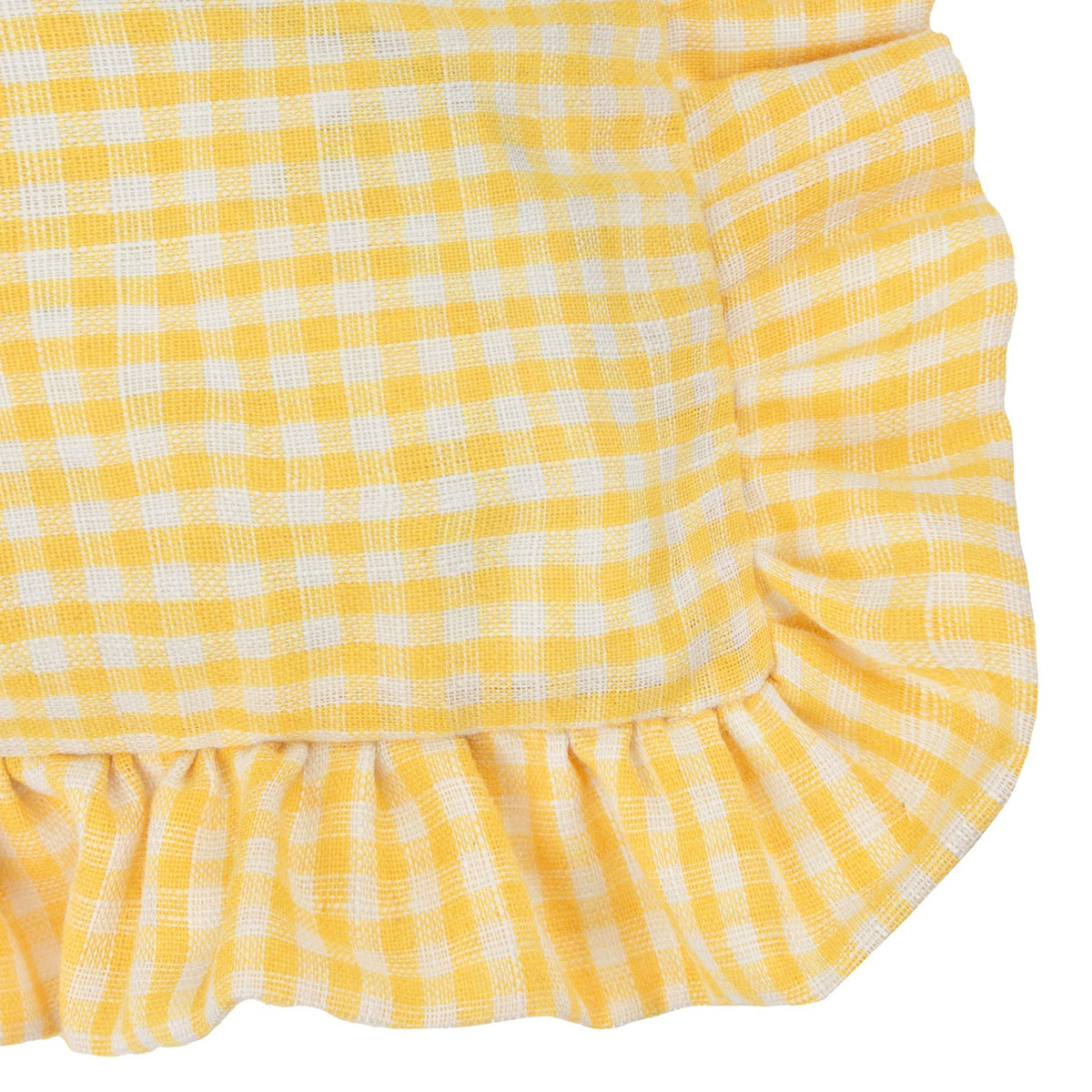Close-up of the Les Petite Fleurs Gingham Cotton Cushion in yellow, showing the small check pattern and gathered frilled trim along a rounded corner edge.