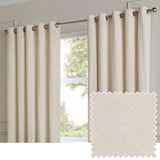 Ivory eyelet curtains in plain velvet fabric hanging on a brushed metal rod by a window, shown with a matching fabric swatch.