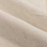 Close-up of Lustre Velvet Plain Fully Lined Eyelet Curtains in ivory, showing the soft velvet pile and folded polyester fabric catching the light.