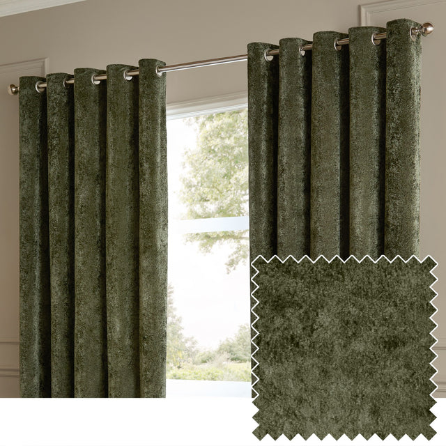 Lustre Velvet eyelet curtains in malachite green, fully lined with silver grommets, shown hanging by a window with a fabric swatch inset.