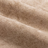 Close-up of Lustre Velvet Plain Fully Lined Eyelet Curtains in oyster, showing the dense, soft-pile velvet fabric with folds highlighting subtle tonal variation.